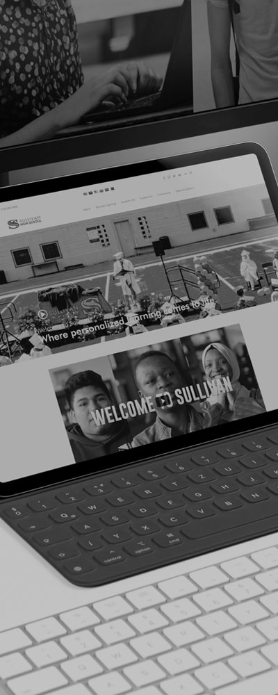 black and white image of laptop with website